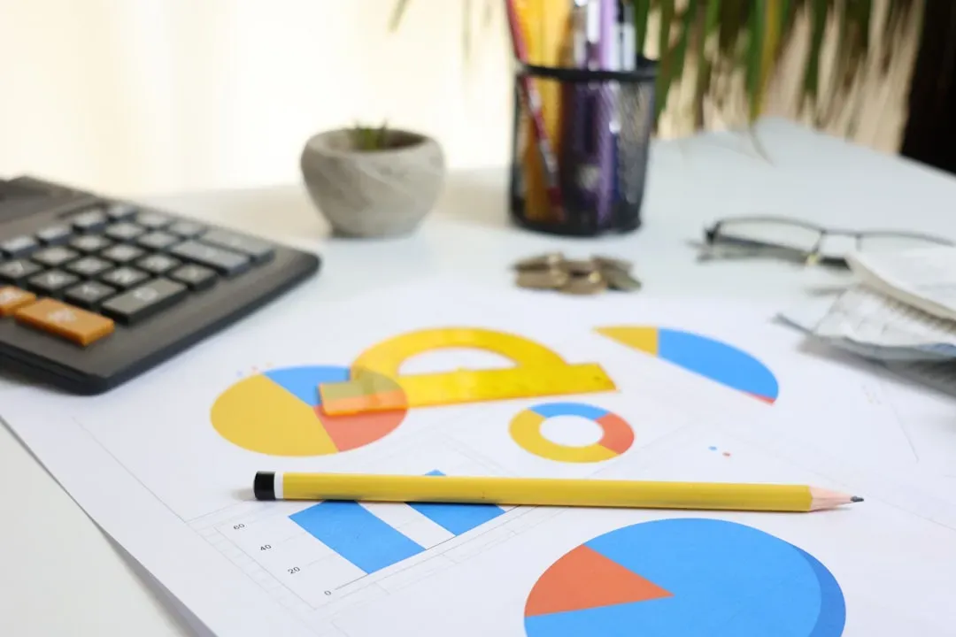 Business owner analyzing financial spreadsheets and startup costs for aquaponics fish farming commercial production at desk w